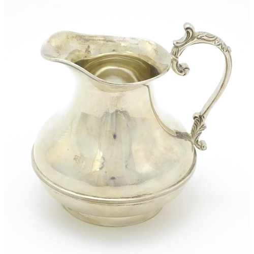 294 - A silver jug hallmarked London 1934, maker Goldsmiths & Silversmiths Co. Ltd. Approx. 4 1/2