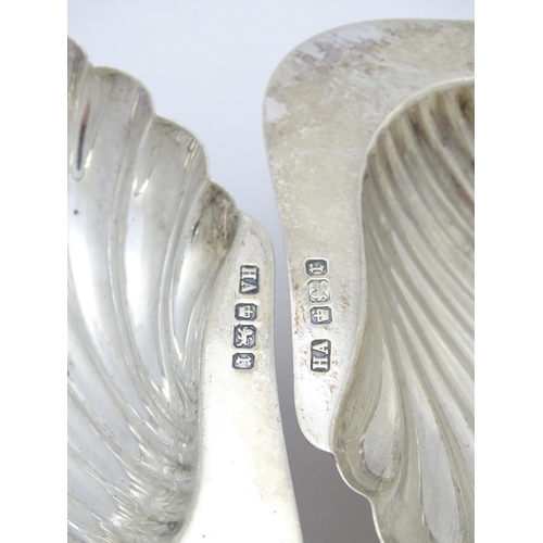 301 - A pair of silver butter dishes of scallop shell form, hallmarked Sheffield 1909, maker Atkin Brother... 