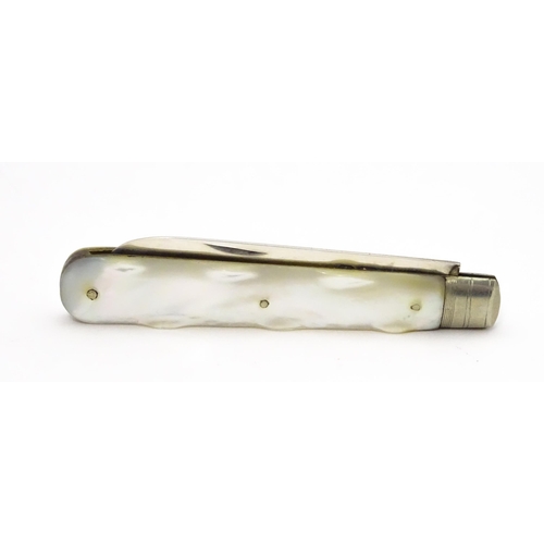 304 - A silver folding fruit knife with mother of pearl handle, hallmarked Sheffield 1901, maker Arthur Wo... 