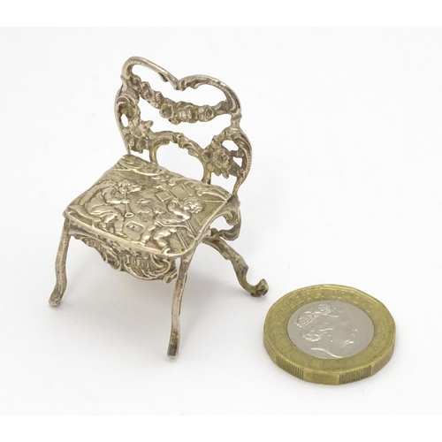 308 - A 19thC Continental .930 silver model of a chair with import marks for London 1897 imported David Br... 