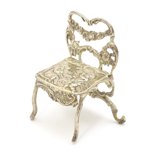 308 - A 19thC Continental .930 silver model of a chair with import marks for London 1897 imported David Br... 