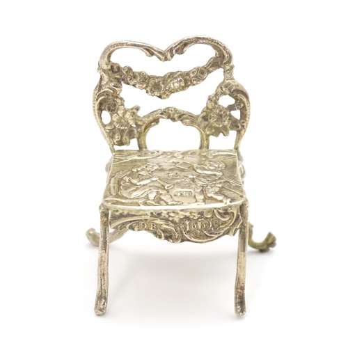 308 - A 19thC Continental .930 silver model of a chair with import marks for London 1897 imported David Br... 