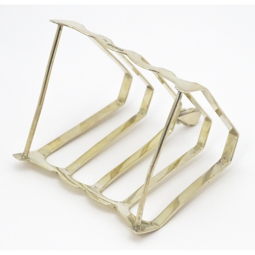 310 - An Art Deco silver five bar toast rack of triangular form hallmarked Birmingham 1938, maker Charles ... 