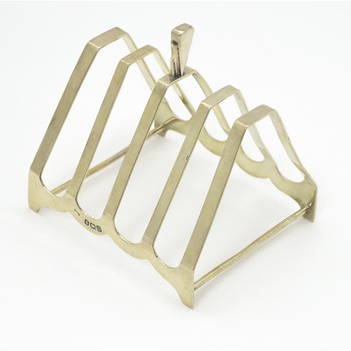 310 - An Art Deco silver five bar toast rack of triangular form hallmarked Birmingham 1938, maker Charles ... 