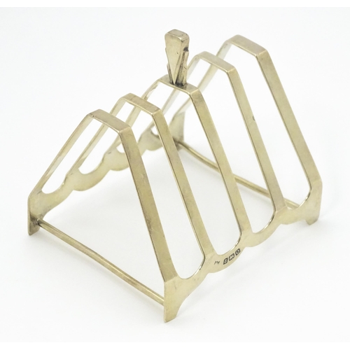 310 - An Art Deco silver five bar toast rack of triangular form hallmarked Birmingham 1938, maker Charles ... 