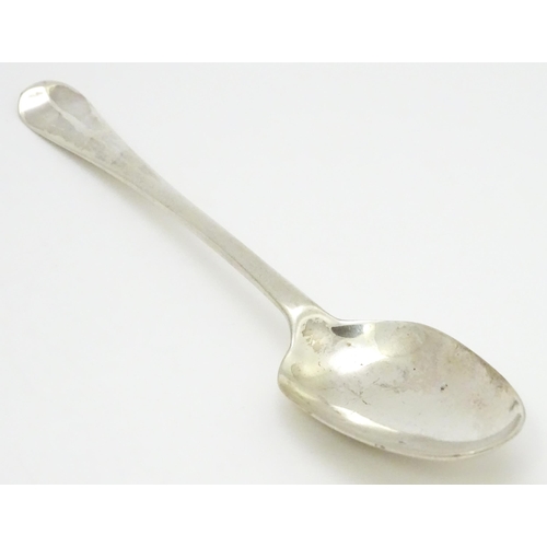 311 - An 18thC silver Hanoverian pattern table spoon hallmarked London 1739, maker Samuel Hutton. Approx. ... 