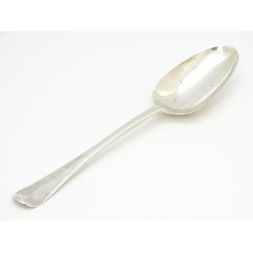 311 - An 18thC silver Hanoverian pattern table spoon hallmarked London 1739, maker Samuel Hutton. Approx. ... 