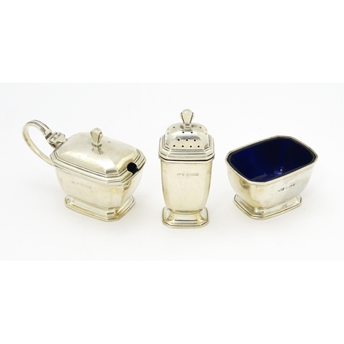 319 - An Art Deco three piece silver cruet set comprising pepper, salt and mustard, hallmarked Birmingham ... 