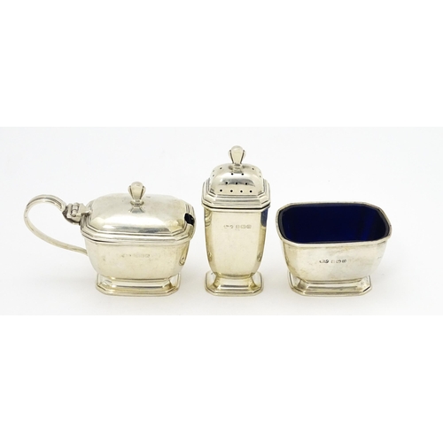 319 - An Art Deco three piece silver cruet set comprising pepper, salt and mustard, hallmarked Birmingham ... 