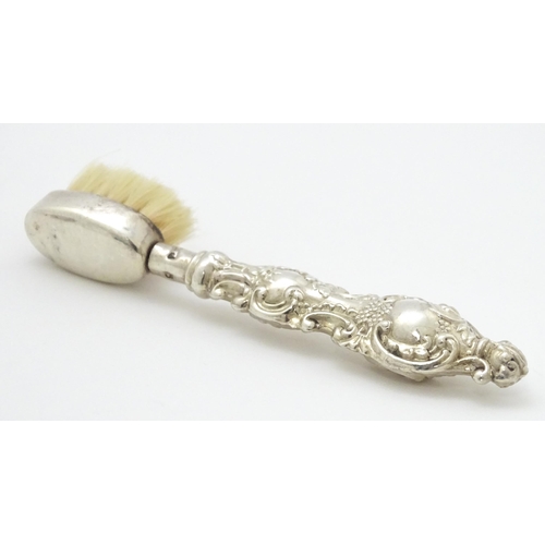 320 - Two silver moustache brushes, one hallmarked Birmingham 1925, maker Henry Clifford Davis, the other ... 