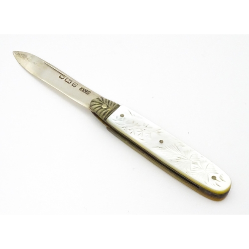 324 - A silver folding fruit knife with engraved mother of pearl handle, hallmarked Sheffield 1905, maker ... 