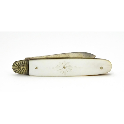 324 - A silver folding fruit knife with engraved mother of pearl handle, hallmarked Sheffield 1905, maker ... 