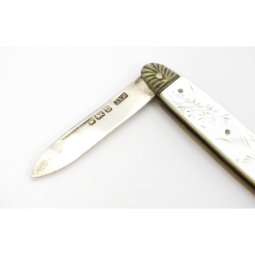 324 - A silver folding fruit knife with engraved mother of pearl handle, hallmarked Sheffield 1905, maker ... 