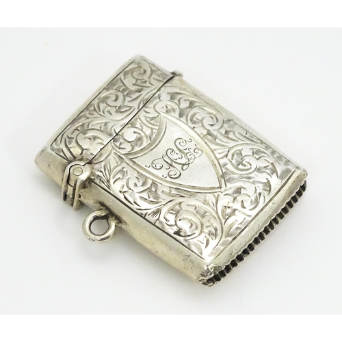 330 - A silver vesta case with engraved acanthus scroll decoration hallmarked Birmingham 1903, maker Const... 