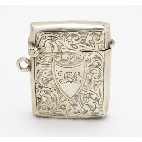 330 - A silver vesta case with engraved acanthus scroll decoration hallmarked Birmingham 1903, maker Const... 