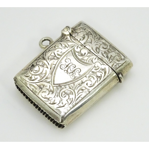 330 - A silver vesta case with engraved acanthus scroll decoration hallmarked Birmingham 1903, maker Const... 