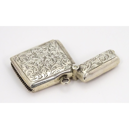 330 - A silver vesta case with engraved acanthus scroll decoration hallmarked Birmingham 1903, maker Const... 