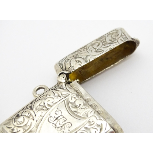 330 - A silver vesta case with engraved acanthus scroll decoration hallmarked Birmingham 1903, maker Const... 