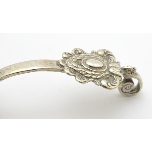 331 - A Dutch silver caddy spoon, bearing import marks for London 1896, importer Edwin Thompson Bryant. Ap... 