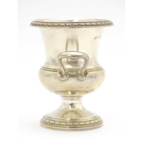 337 - A small silver vase of Classical urn form hallmarked London 1949, maker Adie Brothers Ltd. Approx. 3... 