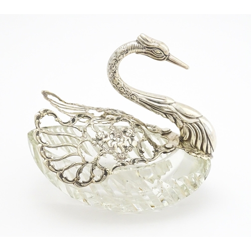 340 - A cut glass and silver table salt modelled as a swan., bearing import marks for London c. 1966, impo... 