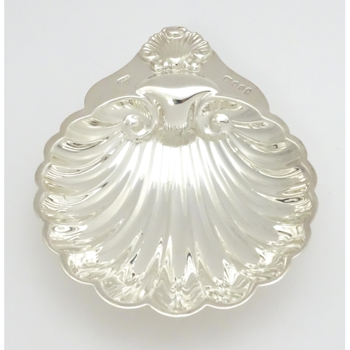 347 - A silver butter dish of scallop shell form hallmarked London 1977 with Silver Jubilee mark, maker A.... 