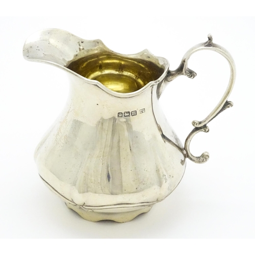 351 - A silver cream jug hallmarked Sheffield 1904, maker Levesley Brothers, stamped under Carmen with reg... 