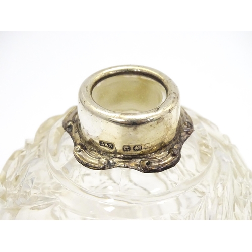 352A - An early 20thC cut glass scent / perfume bottle with silver mounts, maker Levi & Salaman. Approx. 5