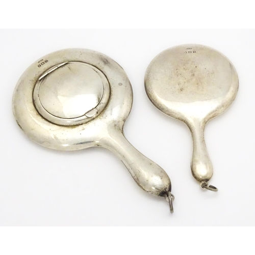 358 - A small silver hand mirror with compact section to back hallmarked Birmingham 1912, maker Crisford &... 