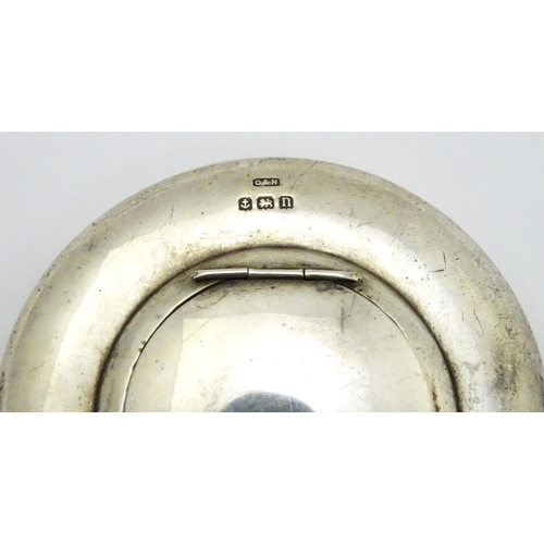 358 - A small silver hand mirror with compact section to back hallmarked Birmingham 1912, maker Crisford &... 