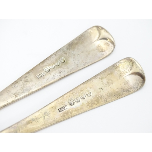 359 - A pair of William IV Irish silver berry spoons, the gilded bowls with embossed flower and bird detai... 