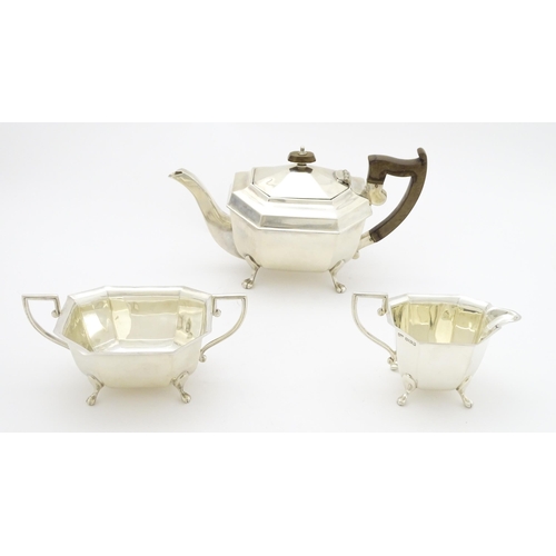 363 - A silver three piece tea set comprising teapot, sugar bowl and milk jug hallmarked Sheffield 1934, m... 