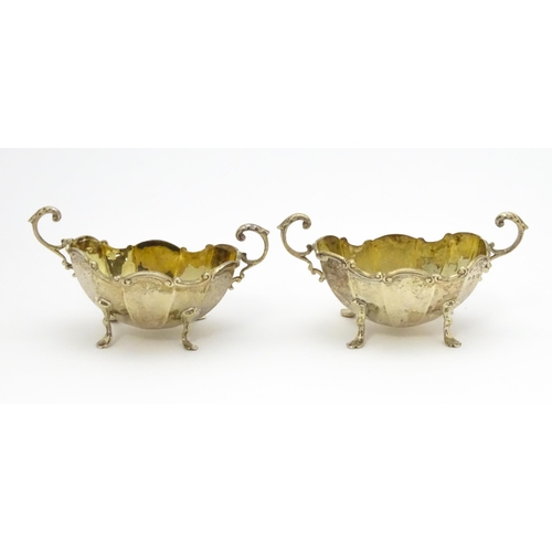 368 - A pair of Victorian silver salts with twin handles hallmarked Birmingham 1897, maker Henry Matthews.... 