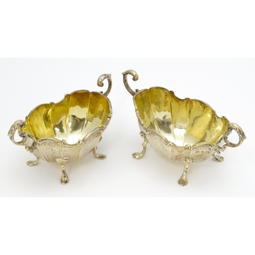 368 - A pair of Victorian silver salts with twin handles hallmarked Birmingham 1897, maker Henry Matthews.... 