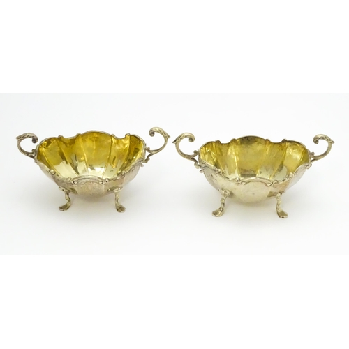 368 - A pair of Victorian silver salts with twin handles hallmarked Birmingham 1897, maker Henry Matthews.... 