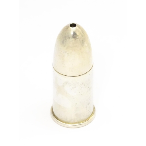 369 - A silver salt of bullet form with gilded interior, hallmarked Birmingham 1914. Approx. 2 1/4