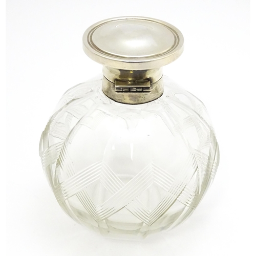 371 - A glass scent / perfume bottle with banded detail, with silver lid hallmarked Birmingham 1918, maker... 