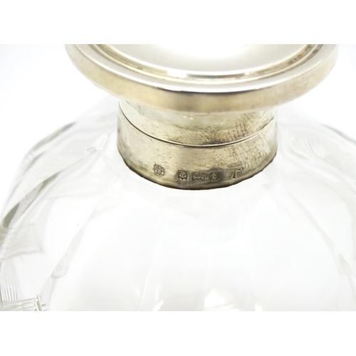 371 - A glass scent / perfume bottle with banded detail, with silver lid hallmarked Birmingham 1918, maker... 