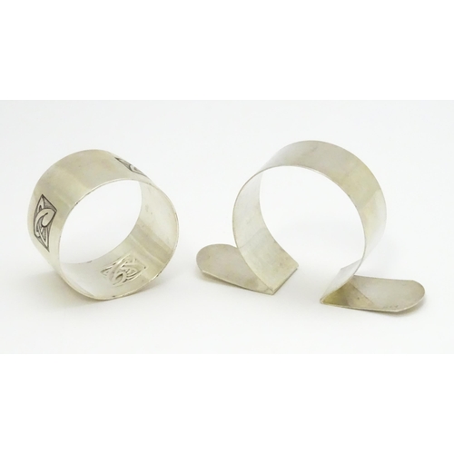 377 - Two silver napkin rings, one with Celtic details hallmarked Birmingham 1908, maker George Unite, the... 