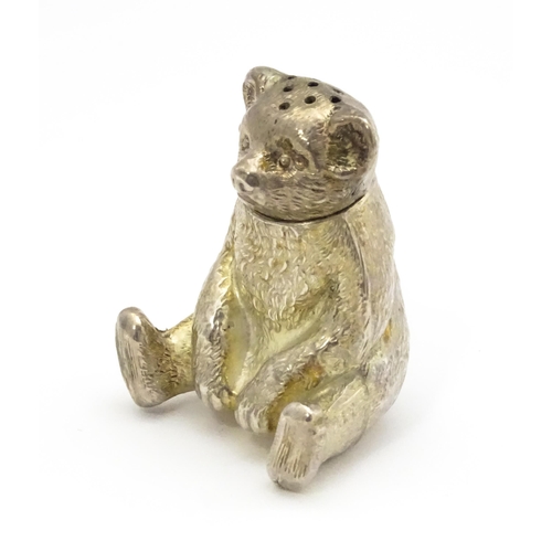 382 - A novelty silver pepperette formed as a teddy bear, hallmarked Birmingham 1909, maker Spurrier & Co.... 