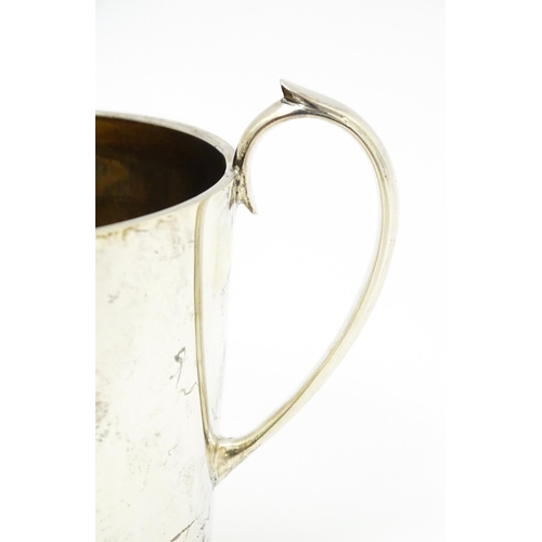 388 - A silver twin handled loving cup with gilded interior, hallmarked Sheffield 1912, maker Atkin Brothe... 