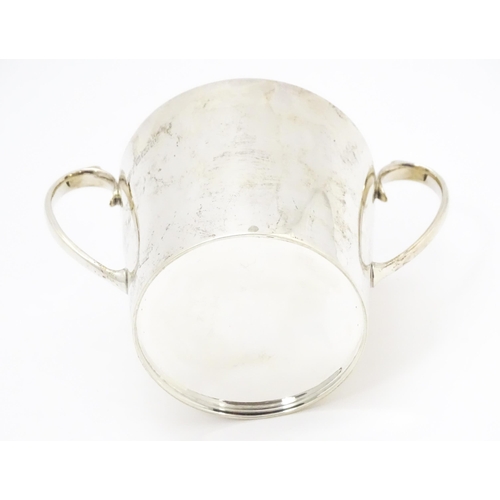 388 - A silver twin handled loving cup with gilded interior, hallmarked Sheffield 1912, maker Atkin Brothe... 