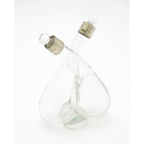 389 - A glass oil and vinegar bottle with silver mounts hallmarked London 1902, maker John Hazlewood Worra... 