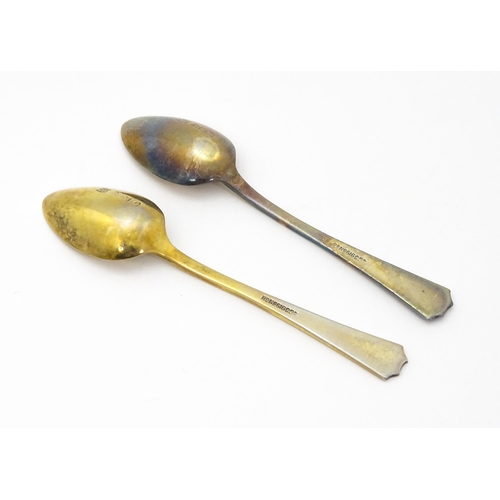 393 - A pair of Art Deco silver gilt teaspoons with enamel decoration to handles, hallmarked Birmingham 19... 