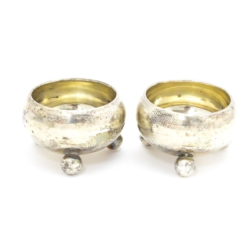 399 - A pair of Victorian silver salts raised on three ball feet, hallmarked Birmingham 1900, maker Hillia... 