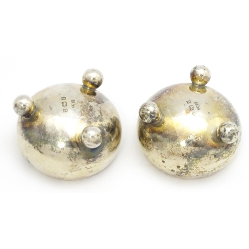 399 - A pair of Victorian silver salts raised on three ball feet, hallmarked Birmingham 1900, maker Hillia... 