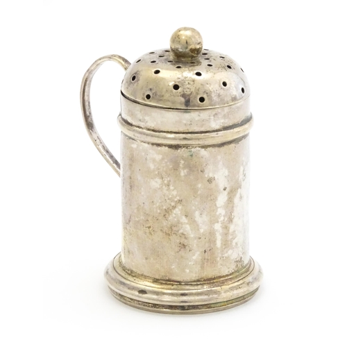 401 - A silver pepperette formed as a small flour shaker, hallmarked London 1814. Approx. 2 3/4