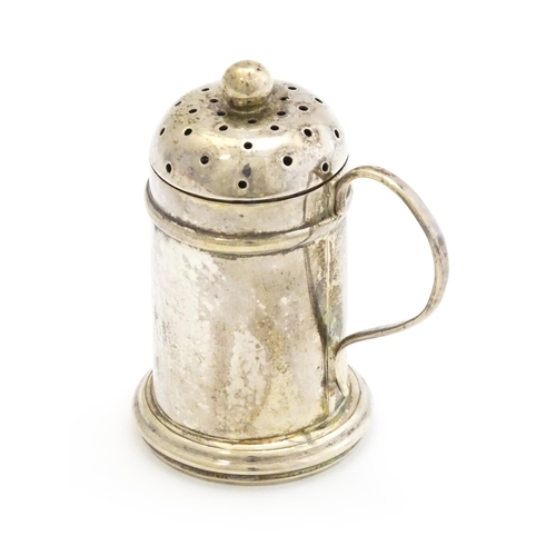 401 - A silver pepperette formed as a small flour shaker, hallmarked London 1814. Approx. 2 3/4