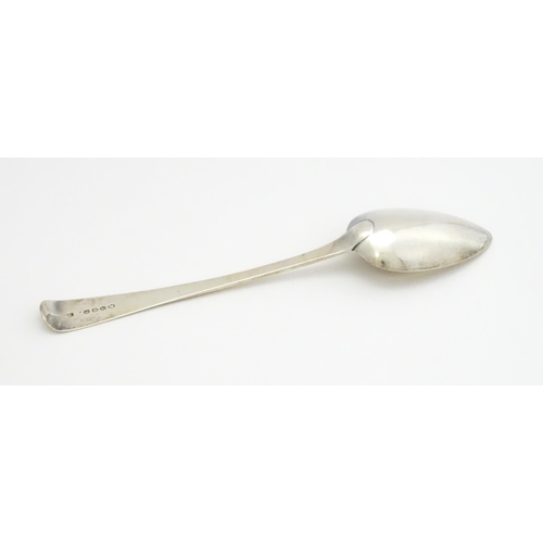 407 - A Geo III silver table spoon hallmarked London 1810, maker Alexander Hewat. Approx. 9