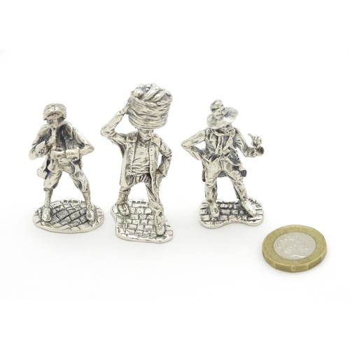 411 - Three silver figures modelled as Charles Dickens style characters hallmarked London 1976, maker SMC.... 